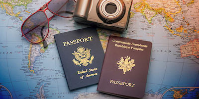 Two Passports on a Map