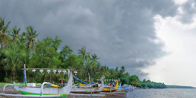 Boats on Shore with Rain Clouds Rolling In